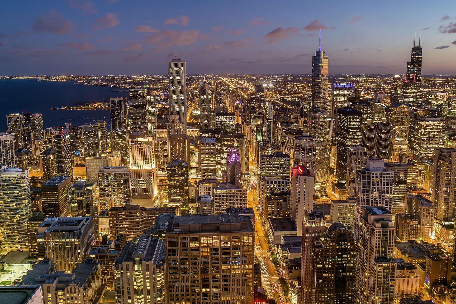 Aerial view of Chicago skyline at night with city lights